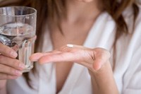 Lady prepares to take over-the-counter pain medication