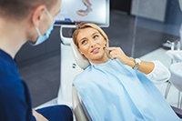 Patient smiling at dentist during check-in visit
