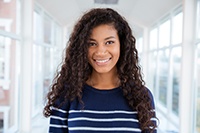 Closeup of teen girl smiling in hallway