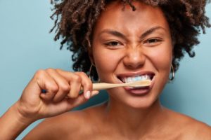 person brushing their teeth