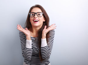 Young woman with bright smile following teeth whitening